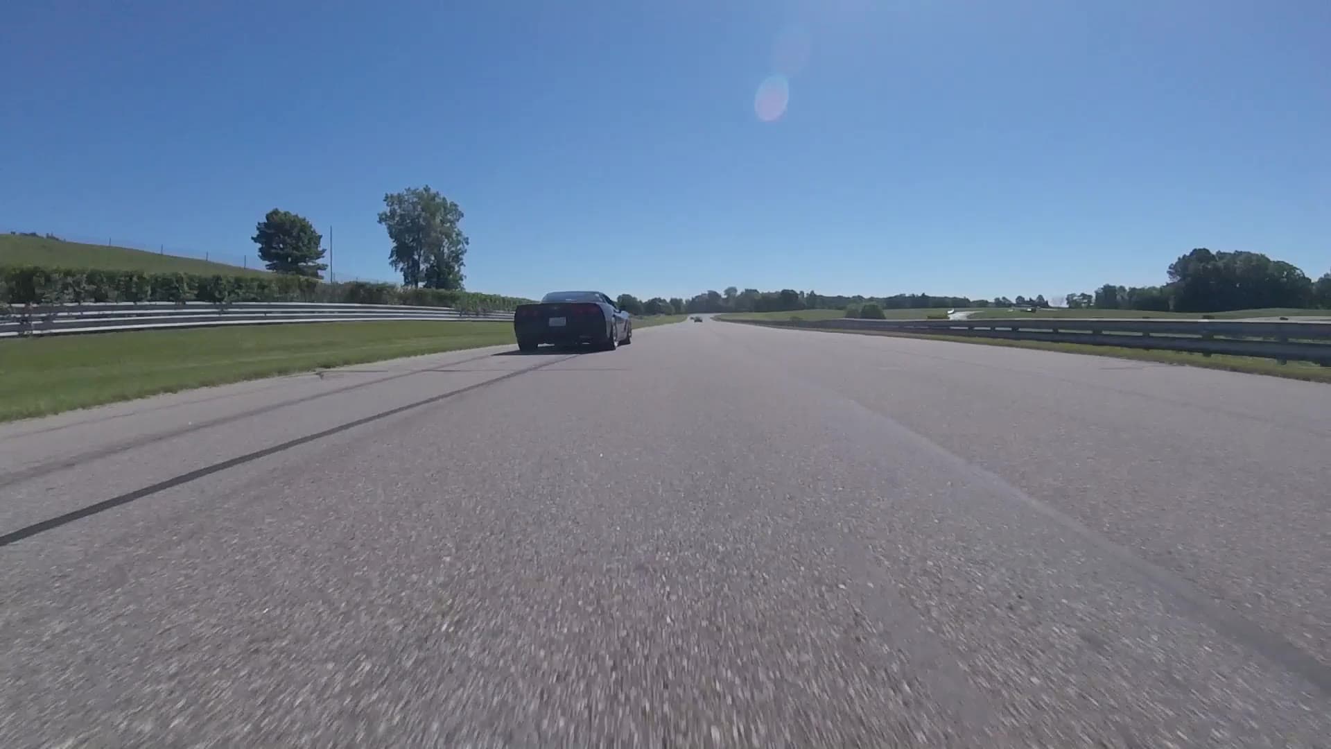 A first-person view of a racetrack, still from the film supplied by HedgePX